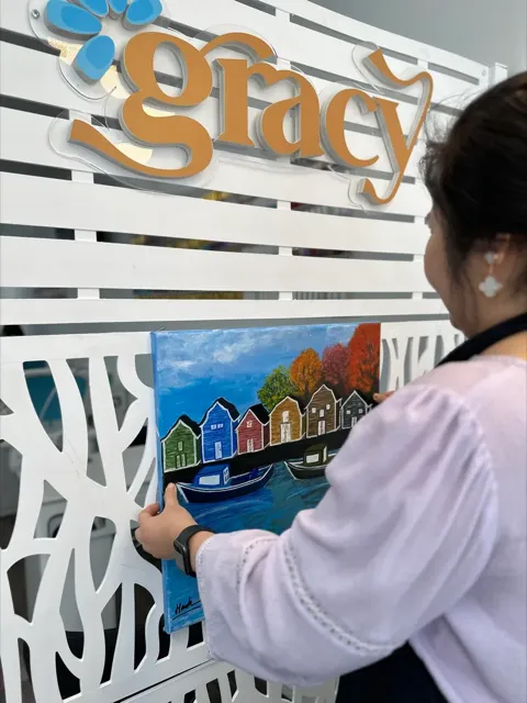 Hannah with her PEI-inspired painting