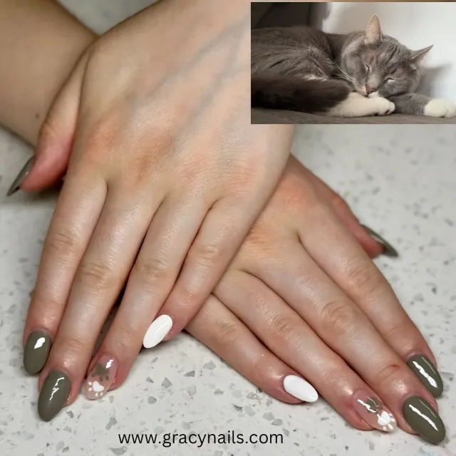 Olive green and white cat-themed nails
